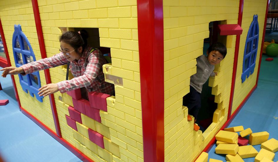Ma Zhen plays with her son at an indoor playground in Beijing October 30. She says she does not plan to have a second child, even as China ends its one-child policy. Kim Kyung-Hoon/Reuters